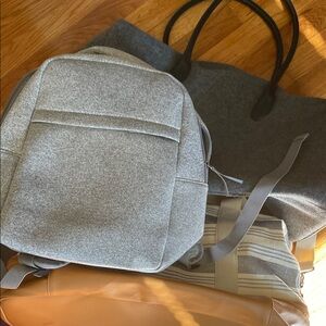 Two duffel bags one small backpack